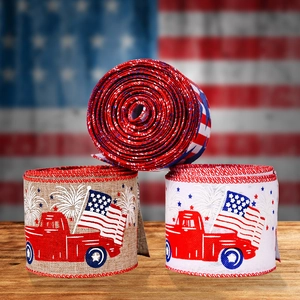 Independence Day ribbons with American flag and red truck prints on rustic wood