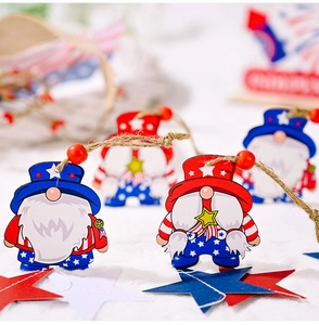Close-up of wooden gnome pendants with US flag design and red wooden beads