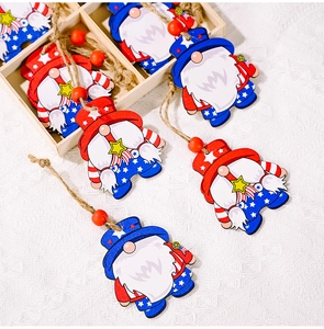 Detail of wooden gnome ornaments in a tray with American flag stars and stripes theme
