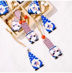 Detail of wooden gnome ornaments with American flag patterns and rustic jute twine hanging loop