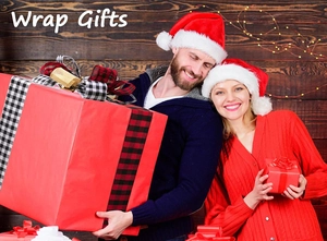 Close-up of red Christmas gift boxes with black and white plaid ribbon and festive decor