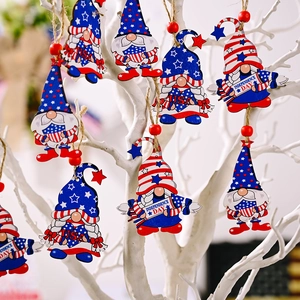 Independence Day wooden gnome ornaments with American flag patterns on a white decorative stand