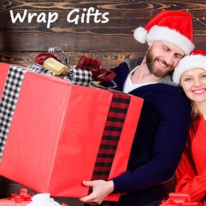 30 inch long plaid Christmas tree topper bow decoration on a red holiday gift box
