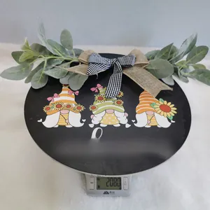 Weight display of a sunflower welcome gnome sign on a scale for home decoration
