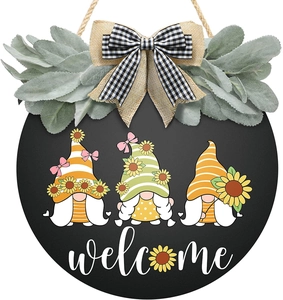 Round door sign with sunflower gnomes, burlap bow and white welcome text on black board