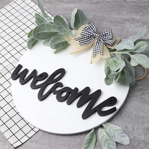 Rustic wooden welcome sign wreath with greenery and layered burlap plaid bows