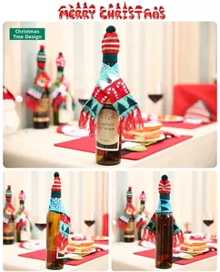 Detailed view of Christmas knit scarf and hat set on wine bottles for festive table decor