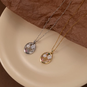 Oval tulip pendant necklace with pink zircon and pearls in gold and silver finish