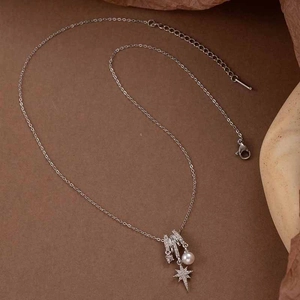 Elegant titanium steel necklace featuring a micro-set star pendant with a white pearl