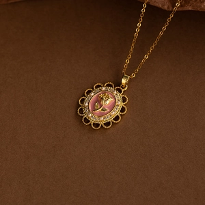 Vintage gold-plated titanium necklace with pink enamel rose pendant and pearl accents