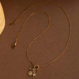 Elegant gold sunflower necklace with zircon moon and star charms on delicate chain
