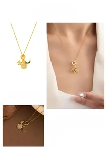 Detailed view of gold necklace set with sunflower, star and blue zircon moon pendants