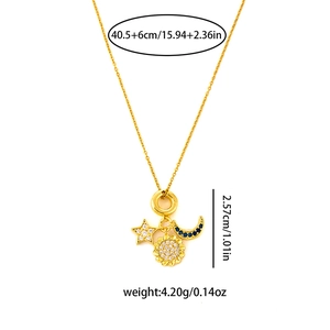 Detail of sunflower, star, and moon pendants with size measurements on a gold chain