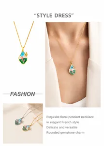 Detail of French style oval pendant necklace with tulip glaze and butterfly pattern