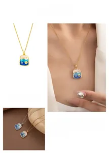 Detailed view of ocean-themed starfish and shell embossed enamel pendant necklaces