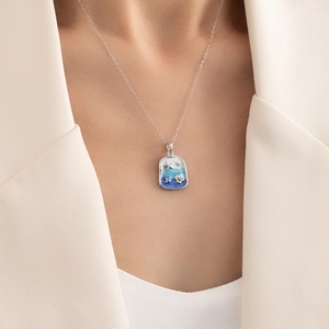 Blue ocean enamel starfish and seashell rectangle pendant necklace on model