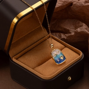 Detailed view of ocean-themed necklace with starfish pendant in a black gift box