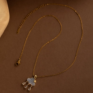 Blue cloud pendant necklace with star accent and hanging zircon raindrops on gold chain