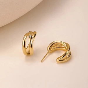 Double-layered C-shaped gold hoop earrings with polished finish and S925 silver needle