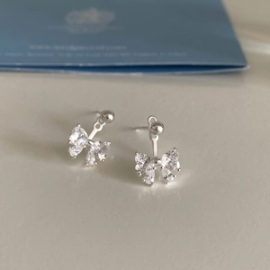 Elegant bow-shaped stud earrings with sparkling cubic zirconia in silver-tone finish