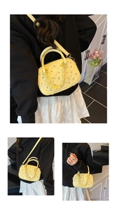 Detail of yellow quilted Boston bag with crystal studs and acrylic chain handle