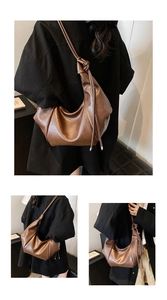 Close-up of brown pleated leather bag showing side knot detail and soft texture