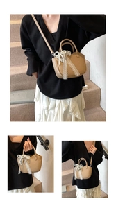 Detail of beige leather crossbody bag featuring pearl charm and white lace bow decoration