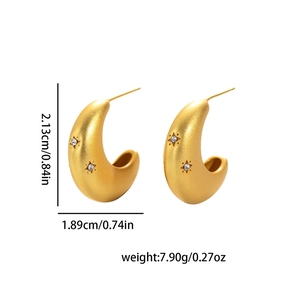 Detail of matte gold crescent earrings with starburst crystal inlay and size dimensions