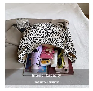 Macro view of leopard print tote bag showing internal capacity with daily essentials