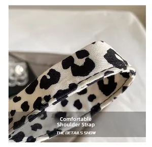 Close-up of leopard print woven shoulder strap showing thick texture and fine stitching