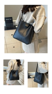 Détails du grand sac seau noir en cuir avec surpiqûres élégantes et fine bandoulière en cuir