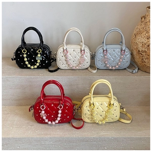 Quilted mini bowling bags with diamond studs and colorful beaded floral charms in five colors
