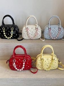 Quilted boston bags with studs and flower chain charms in five vibrant colors