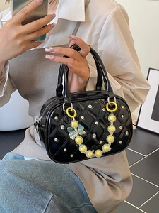 Quilted black mini boston bag with yellow beaded chain and sparkling rhinestone details