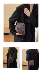 Detail view of mini brown crossbody bag with 3D rabbit ear design and fine stitching