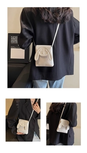 Detail of white PU crossbody bag featuring 3D bunny ears and embroidered rabbit design