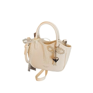 Elegant off-white lychee texture handbag with lace bow and pearl heart charm