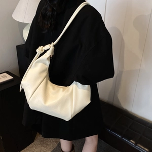 Minimalist beige large capacity hobo bag with knotted shoulder strap for daily commuting