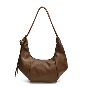Brown soft leather crescent hobo bag with knotted shoulder strap for women