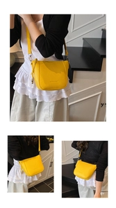 Three-way view of a yellow lychee texture crossbody bag with silver ball charm detail