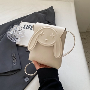 Fashionable beige mini crossbody phone bag with cute cartoon rabbit design and shoulder strap