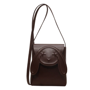 Cute dark brown leather bunny crossbody bag with unique X-eye design and long shoulder strap