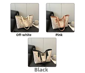 Detail view of quilted tote bags featuring cute cartoon prints in white, pink and black