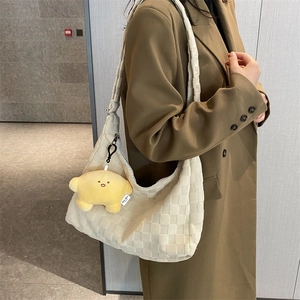 Off-white woven hobo shoulder bag for women with cute star plush keychain accessory