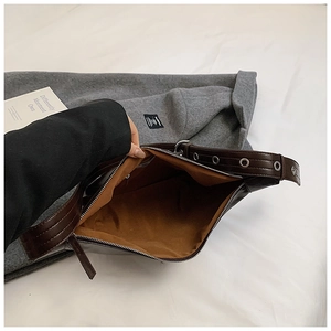 Top view of spacious brown faux leather hobo bag showing caramel interior and metal zipper