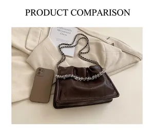 Size comparison of dark brown pleated leather chain bag with phone and book on beige background