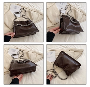 Detail of dark brown crinkled leather handbag with silver chunky chain and quad-view layout
