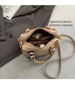 Top view of open beige crossbody bag showing spacious interior with daily essentials