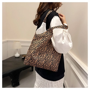Detail showing the large capacity and wide straps of leopard print canvas tote bag
