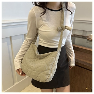 Quilted heart-pattern crescent bag with knotted shoulder strap for casual wear